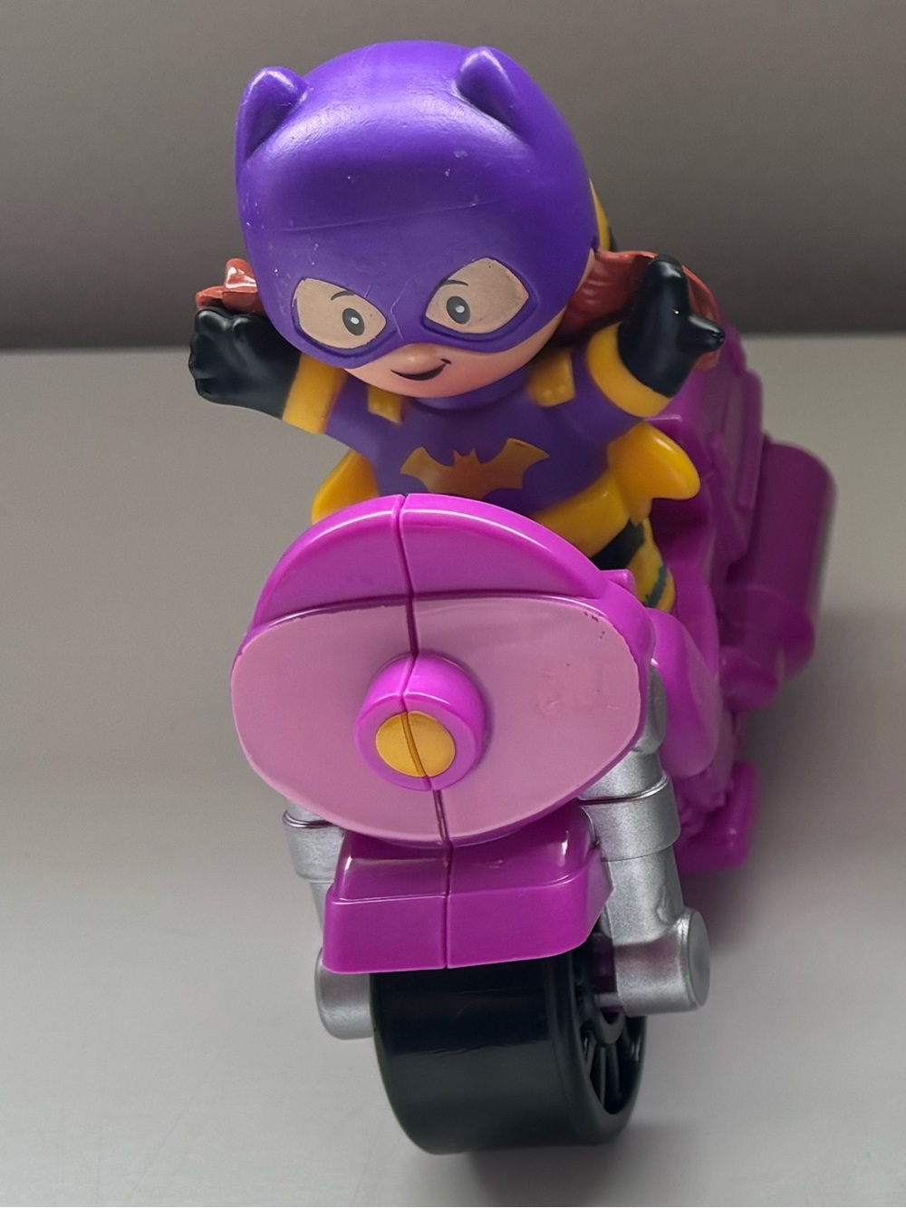 Little people bat girl with vehicle